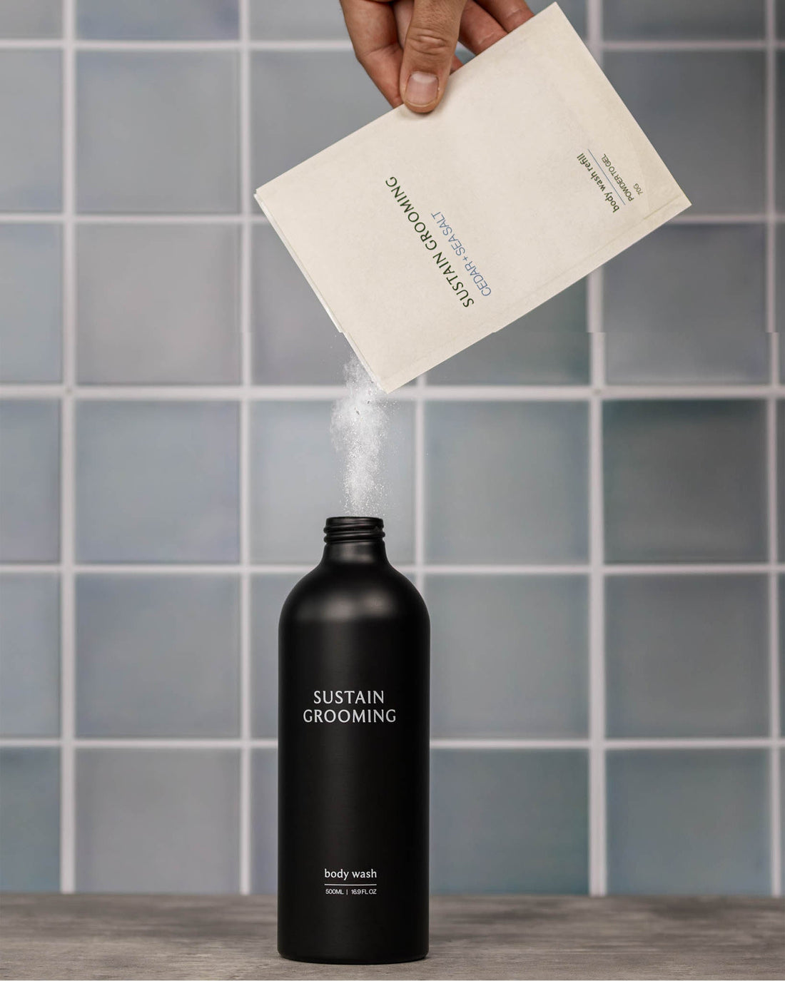 Powder to Gel body wash being added to a reusable bottle